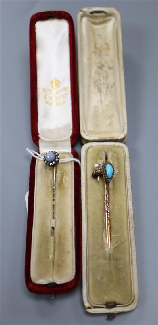 A Victorian yellow metal, star sapphire and diamond cluster set stick pin, 62mm, and two others.